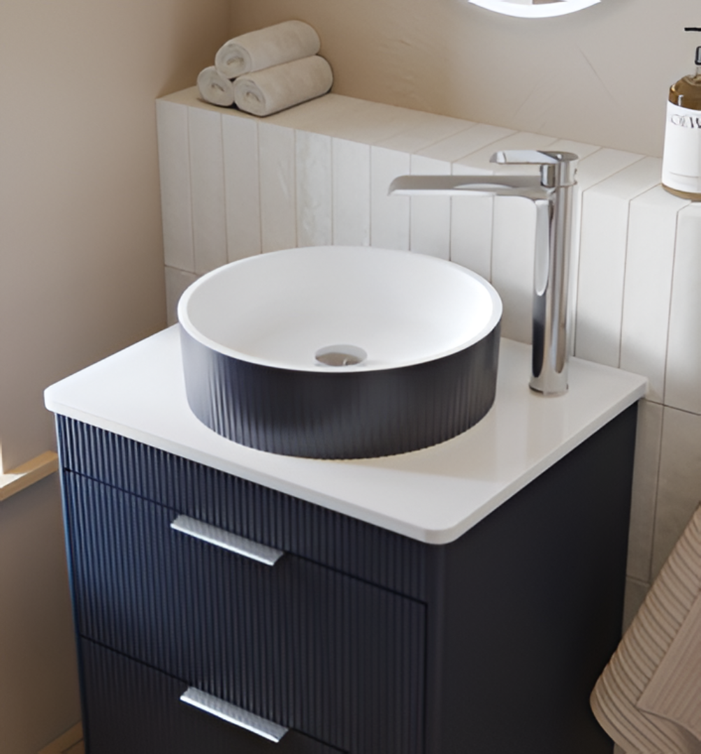 Modern black bathroom vanity with a round vessel sink, white basin, and premium chrome tap installation.